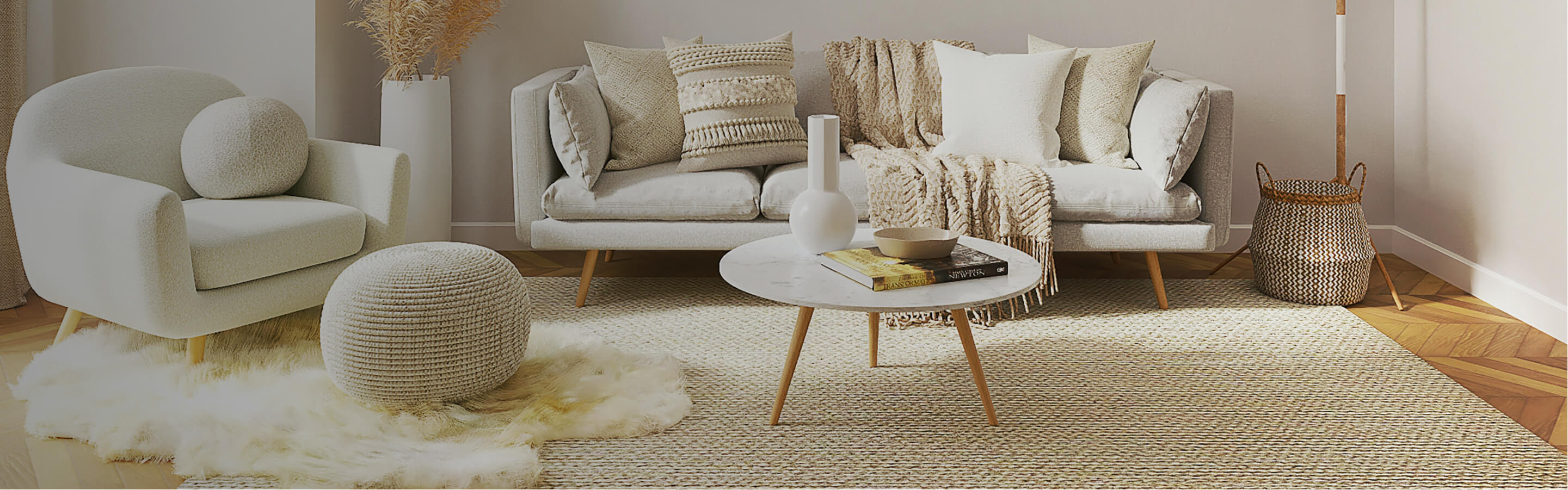 Cream living room with hardwood floor and area rug. 