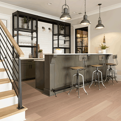 warm toned hardwood flooring in kitchen wet bar